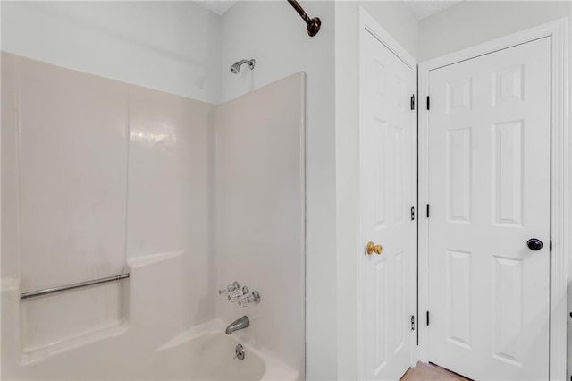 bathroom with shower / bathing tub combination