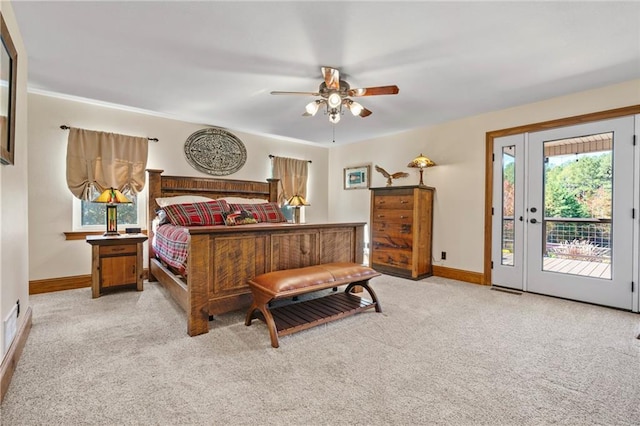 carpeted bedroom with access to exterior, ceiling fan, and baseboards