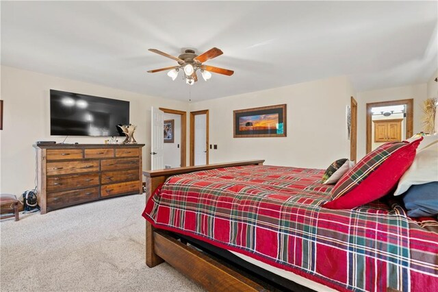 carpeted bedroom featuring a ceiling fan