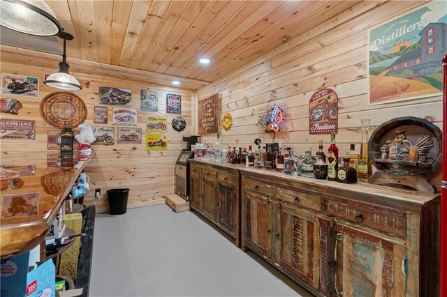 bar featuring a dry bar, wooden ceiling, hanging light fixtures, finished concrete floors, and recessed lighting