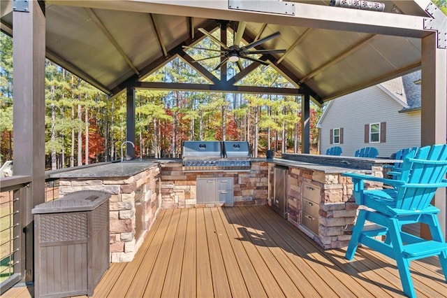 wooden terrace featuring a gazebo, area for grilling, and a ceiling fan