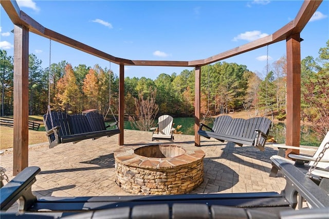 view of patio with a fire pit