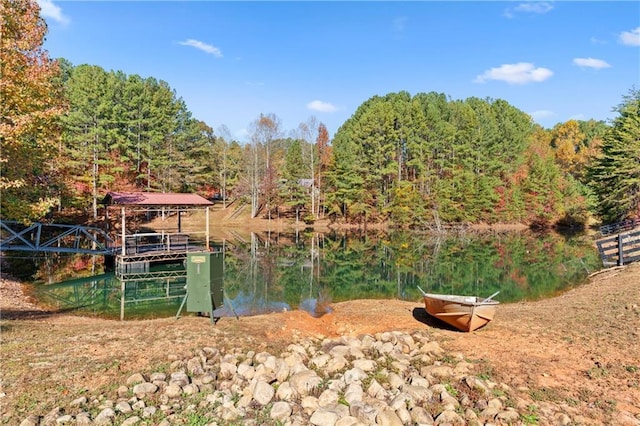 dock area featuring a wooded view