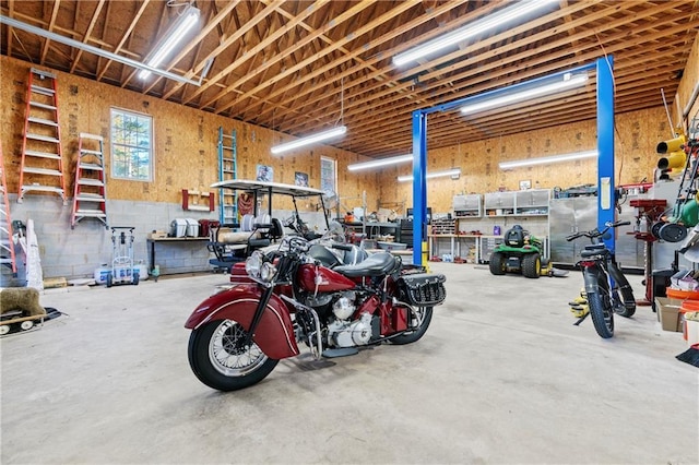 garage with a workshop area