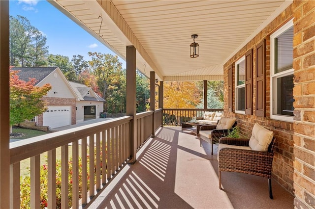 balcony with covered porch and outdoor lounge area