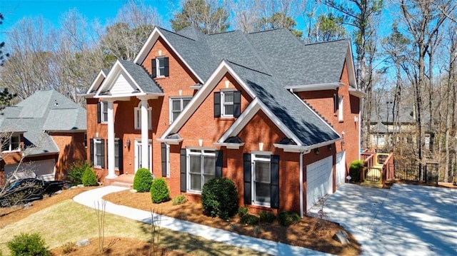 1105 River Laurel Dr, Suwanee, GA 30024 - view of front of property with driveway, brick siding, a shingled roof, and an attached garage