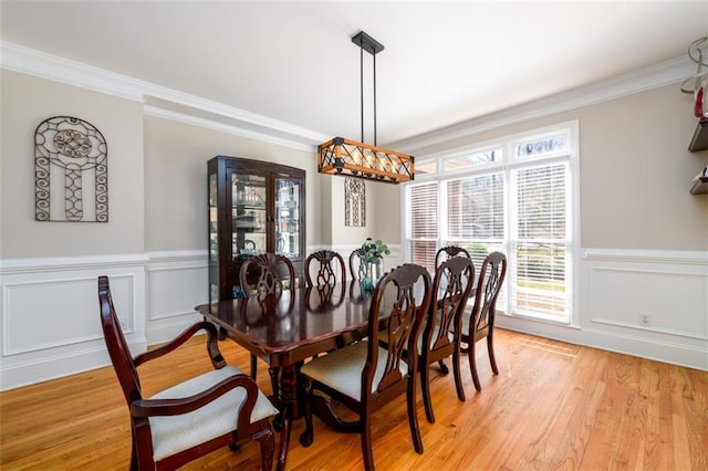1105 River Laurel Dr, Suwanee, GA 30024 - dining room with crown molding, light wood-style floors, wainscoting, and a decorative wall