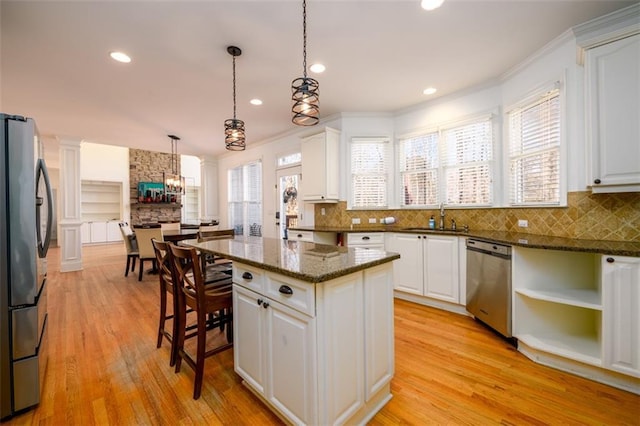 1105 River Laurel Dr, Suwanee, GA 30024 - kitchen with stainless steel appliances, a sink, a chandelier, white cabinetry, and recessed lighting