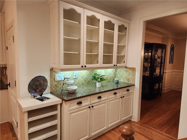 1105 River Laurel Dr, Suwanee, GA 30024 - bar area featuring crown molding, light wood finished floors, decorative backsplash, a wainscoted wall, and a decorative wall
