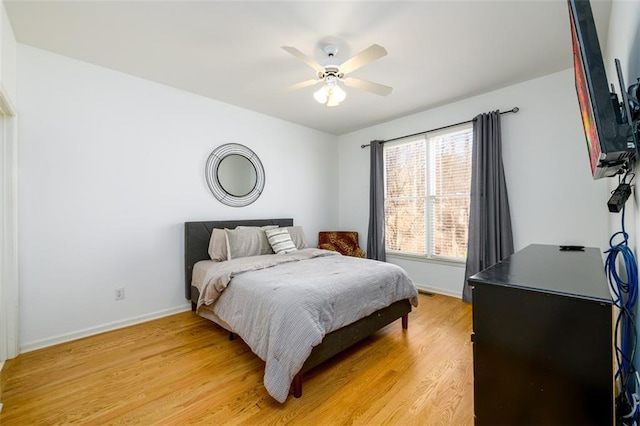 1105 River Laurel Dr, Suwanee, GA 30024 - bedroom featuring baseboards, light wood-style flooring, and a ceiling fan