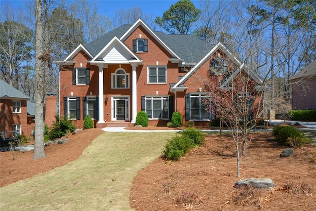1105 River Laurel Dr, Suwanee, GA 30024 - neoclassical / greek revival house featuring brick siding and a front yard