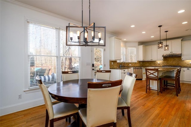 1105 River Laurel Dr, Suwanee, GA 30024 - dining space with ornamental molding, recessed lighting, light wood-style flooring, a chandelier, and baseboards