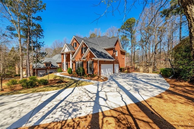 1105 River Laurel Dr, Suwanee, GA 30024 - view of front of property with concrete driveway, brick siding, and an attached garage
