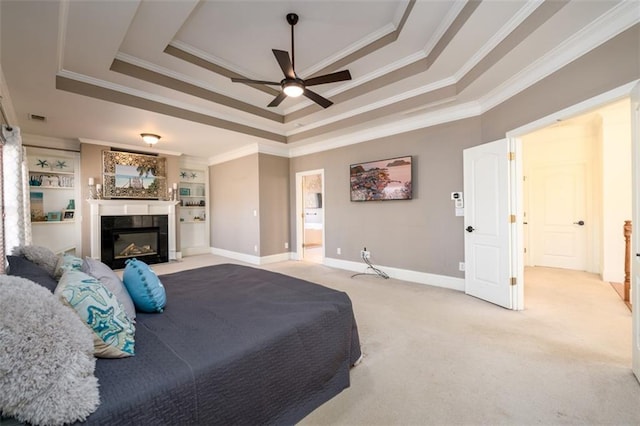 1105 River Laurel Dr, Suwanee, GA 30024 - bedroom with crown molding, light carpet, a raised ceiling, a fireplace, and baseboards