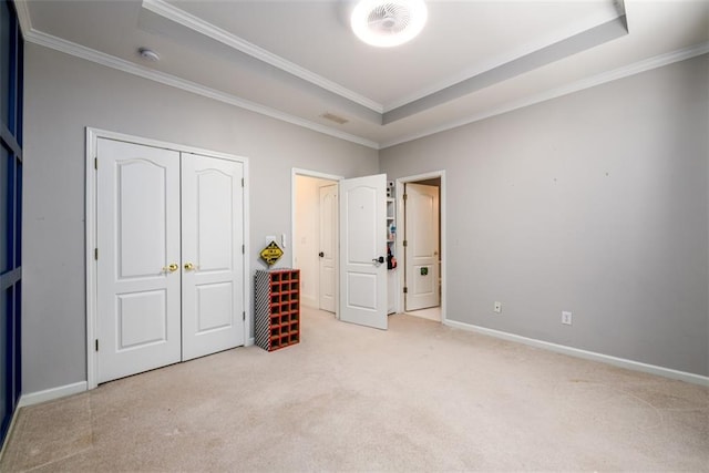 1105 River Laurel Dr, Suwanee, GA 30024 - unfurnished bedroom with a raised ceiling, crown molding, carpet, baseboards, and a closet