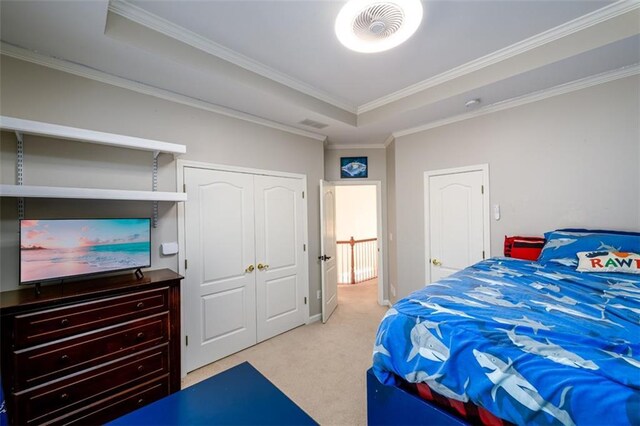 1105 River Laurel Dr, Suwanee, GA 30024 - bedroom featuring light colored carpet, crown molding, a tray ceiling, and a closet