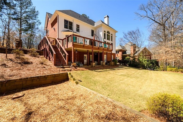 1105 River Laurel Dr, Suwanee, GA 30024 - back of house with stairs, a chimney, a deck, and a yard