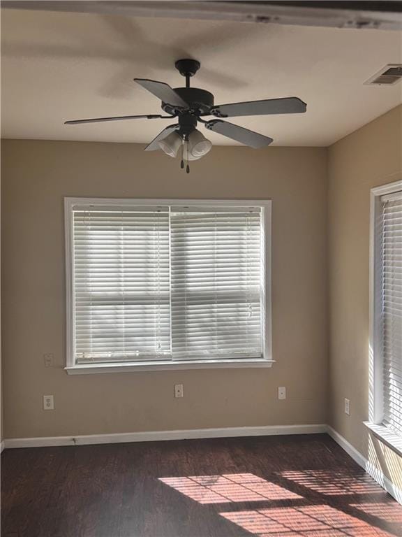 empty room featuring dark hardwood / wood-style floors and ceiling fan