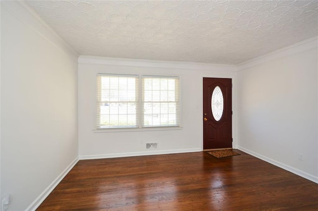 entryway featuring visible vents, plenty of natural light, a textured ceiling, and wood finished floors