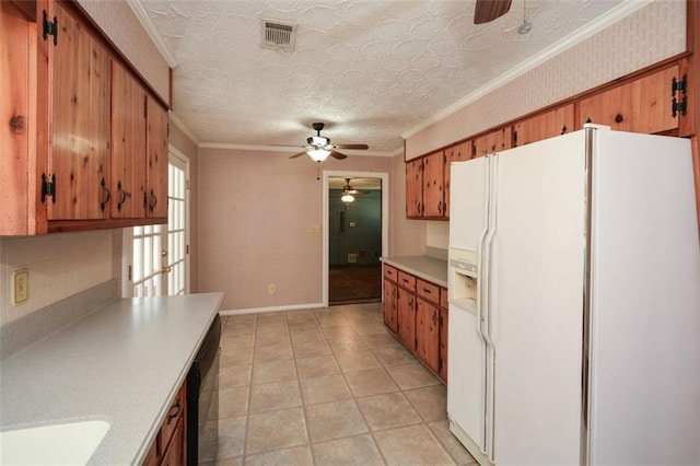 kitchen with wallpapered walls, light countertops, white fridge with ice dispenser, and ornamental molding