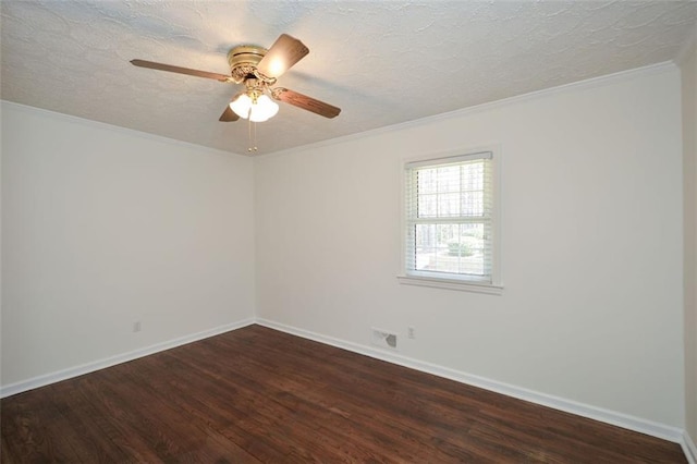 empty room featuring dark wood finished floors, ornamental molding, baseboards, and a textured ceiling