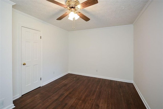 unfurnished room featuring dark wood-style floors, a textured ceiling, baseboards, and ornamental molding