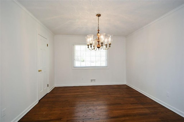 unfurnished room featuring dark wood finished floors, a notable chandelier, crown molding, and baseboards