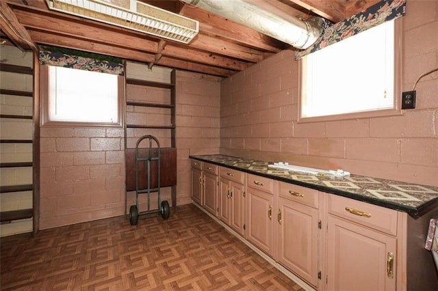 kitchen featuring dark stone countertops