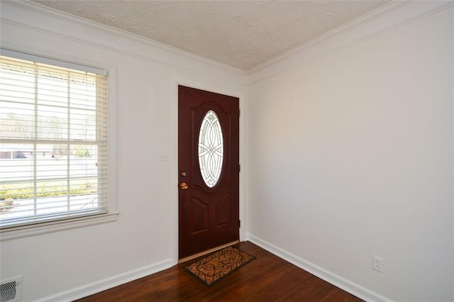 foyer entrance with visible vents, baseboards, a textured ceiling, and dark wood finished floors