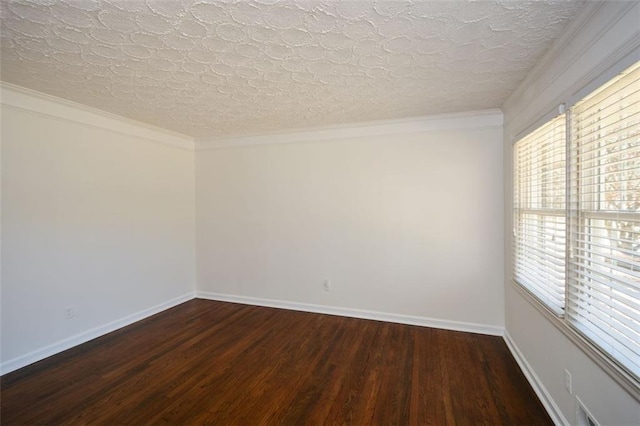 unfurnished room with dark wood-type flooring, crown molding, and baseboards