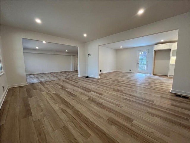 unfurnished living room with light hardwood / wood-style flooring