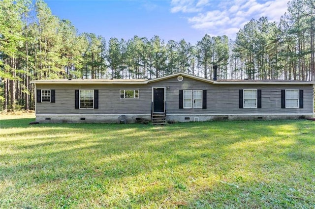 manufactured / mobile home featuring a front lawn