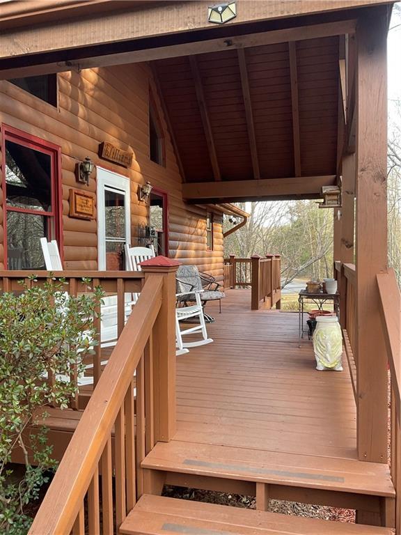 wooden terrace featuring a porch