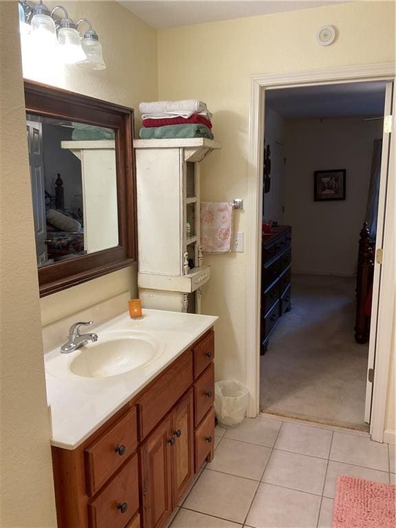 bathroom featuring tile patterned flooring and vanity