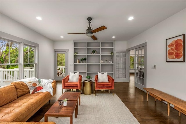 living area with french doors, recessed lighting, ceiling fan, and wood finished floors