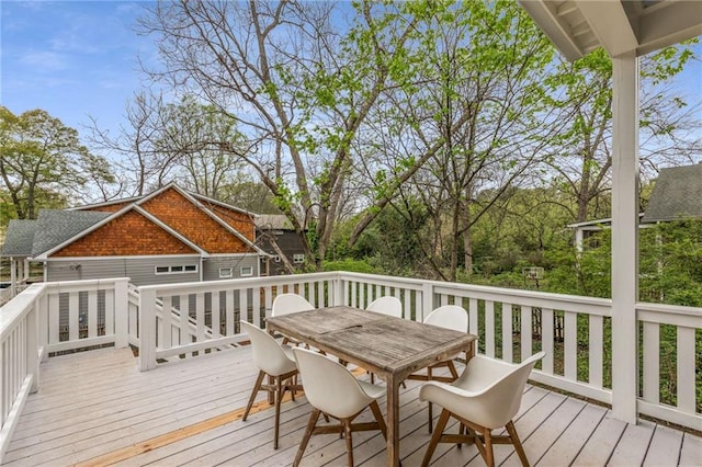 wooden deck with outdoor dining area