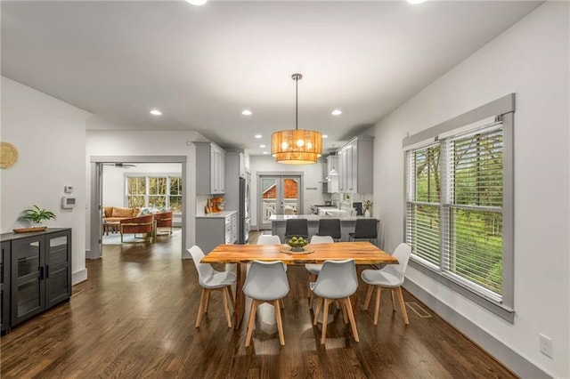 dining room featuring dark wood-style floors, baseboards, recessed lighting, and a chandelier