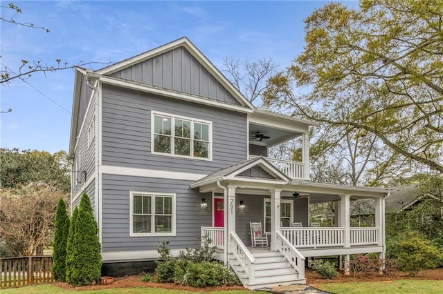 view of front of property featuring ceiling fan, board and batten siding, a porch, and fence
