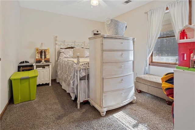 bedroom featuring baseboards, ceiling fan, visible vents, and carpet flooring