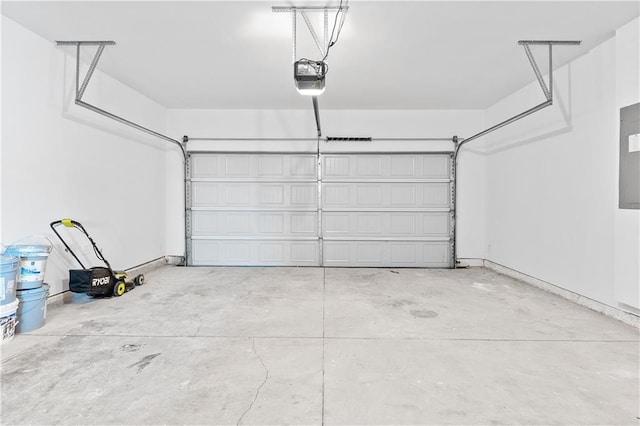 3660 Cattle Field Xing, Loganville, GA 30052 - garage featuring a garage door opener and electric panel