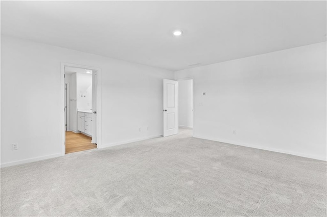 3660 Cattle Field Xing, Loganville, GA 30052 - spare room featuring light colored carpet and recessed lighting