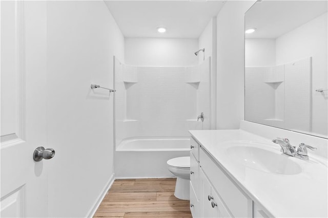 3660 Cattle Field Xing, Loganville, GA 30052 - full bathroom with vanity, wood finished floors, and washtub / shower combination