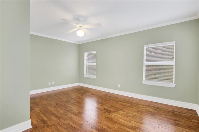 empty room with hardwood / wood-style flooring, ceiling fan, and ornamental molding