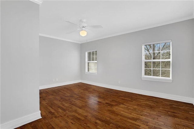 spare room featuring crown molding, ceiling fan, and dark hardwood / wood-style flooring