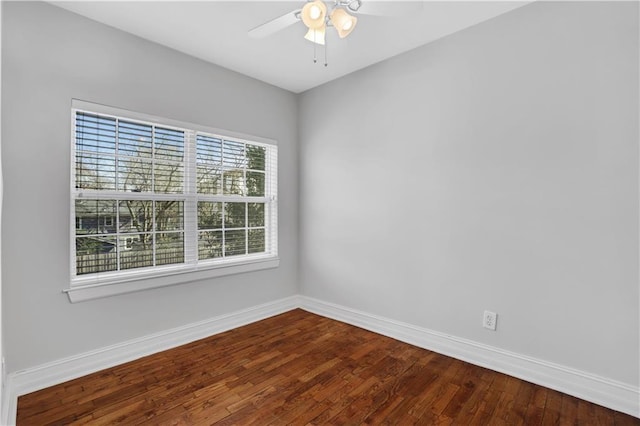 spare room featuring hardwood / wood-style floors and ceiling fan