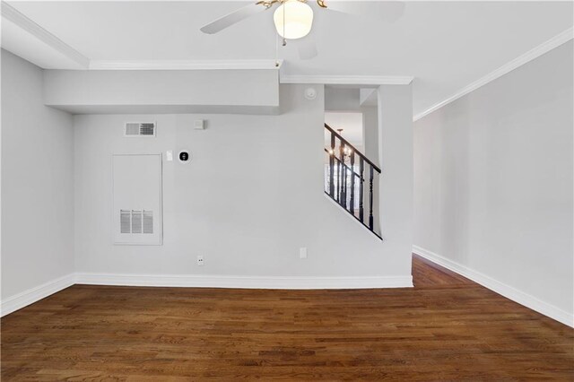 empty room featuring hardwood / wood-style flooring, ceiling fan, and ornamental molding