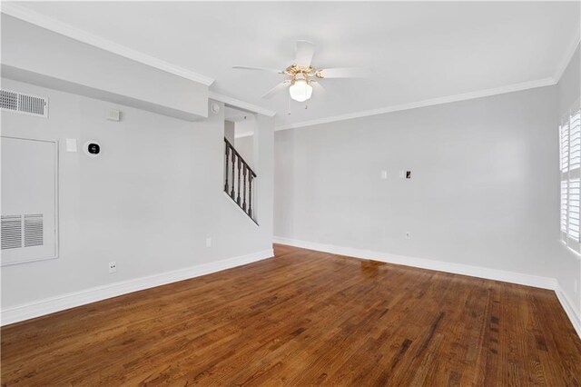 entrance foyer with crown molding, ceiling fan, a healthy amount of sunlight, and dark hardwood / wood-style floors