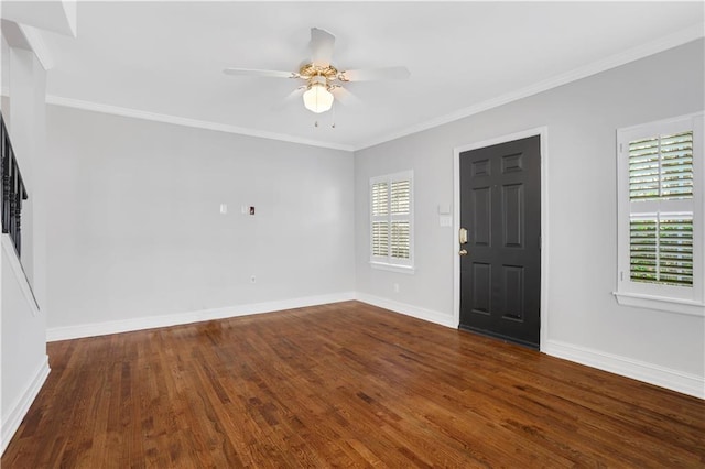 entrance foyer featuring crown molding, dark hardwood / wood-style floors, and ceiling fan