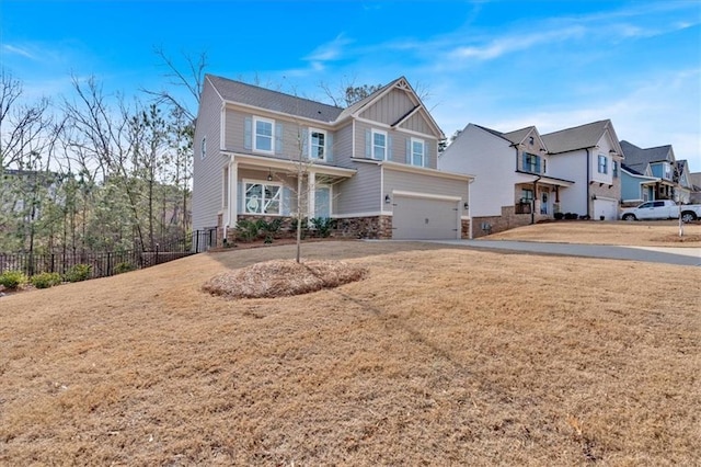 view of front of home with a garage and a front lawn