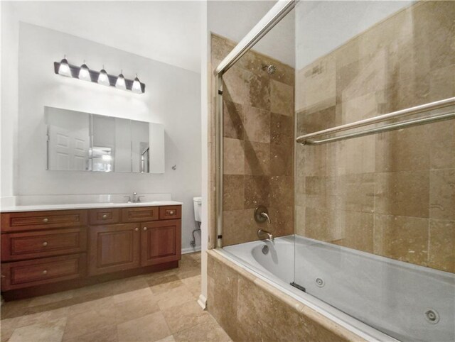 bathroom with shower / bath combination with glass door, tile patterned flooring, and vanity